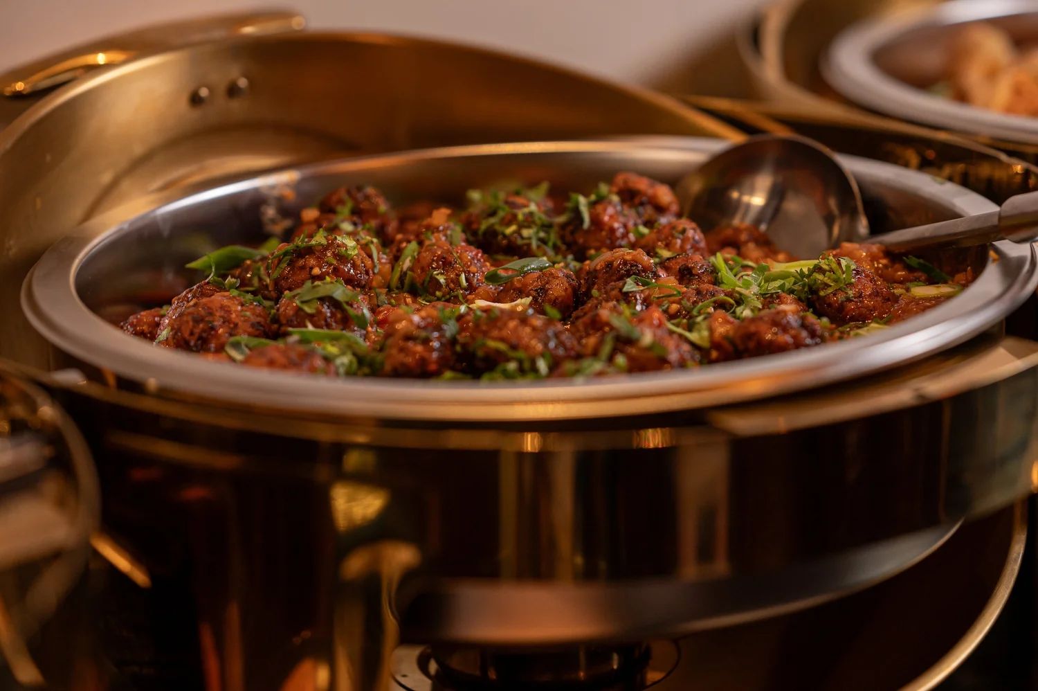 Chilli chicken served from a chafing dish